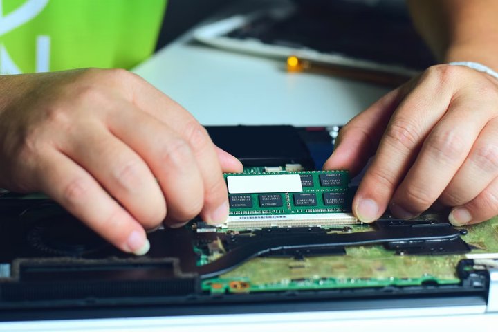 a-technician-swapping-the-ram-in-a-laptop5