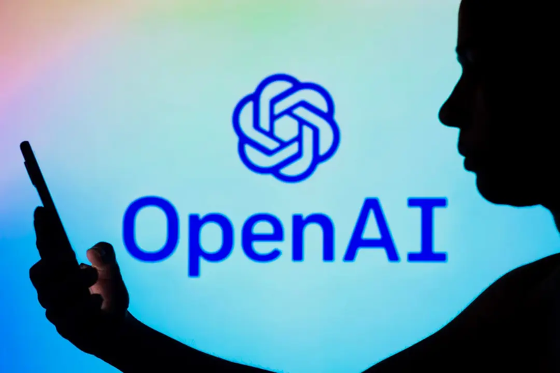 someone-using-phone-openai-logo-dark-shadow-6410b79afc5aadb2f17063bd.webp
